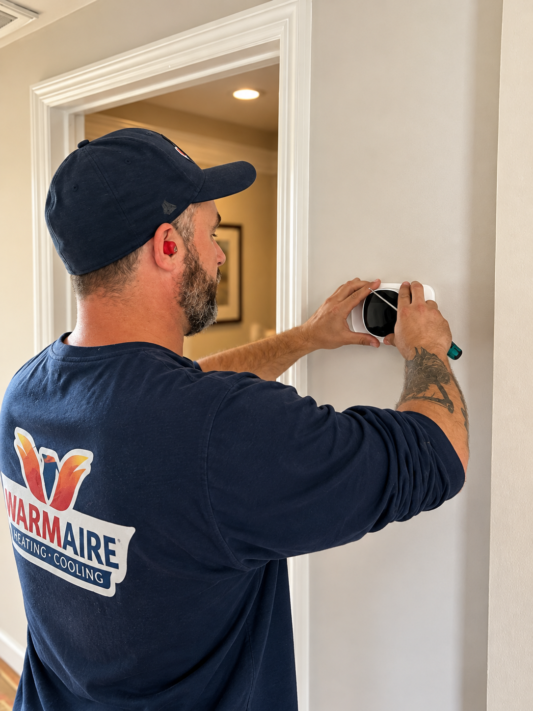 Technician Installing Smart Thermostat